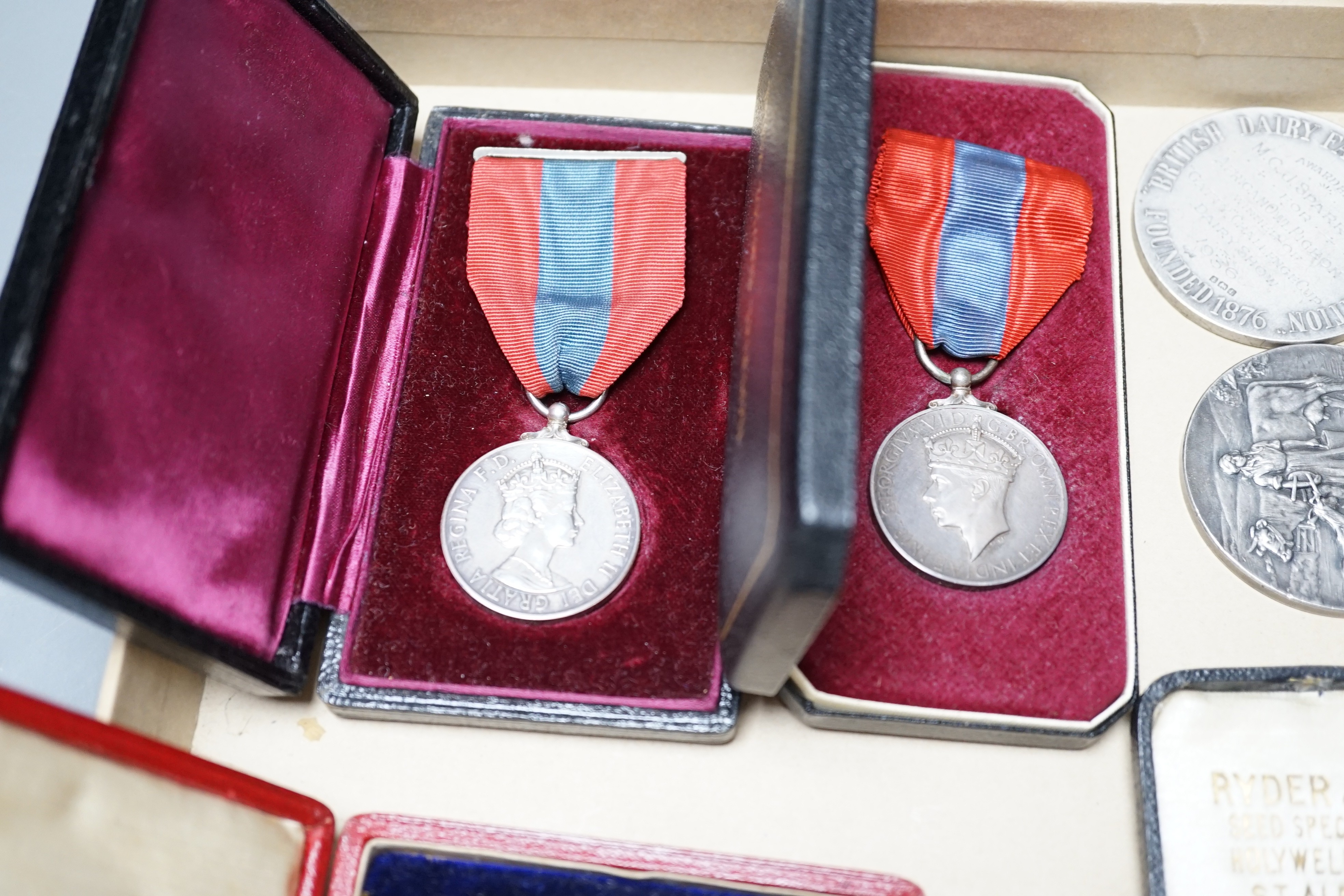 A group of silver commemorative medals, a Victoria 1889 crown, 1880 halfcrown, two cased ISM and to WW1 medals